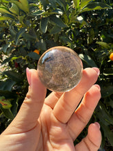 Load image into Gallery viewer, Small Light Smoky Quartz Crystal Sphere
