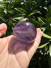 Load image into Gallery viewer, Purple Ribbon Candy Fluorite Sphere
