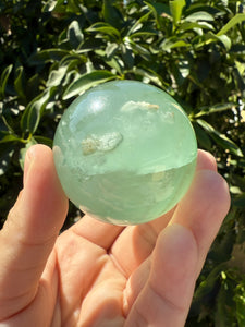 Green Fluorite Crystal Sphere with Unique Crystal Cavities Mineral Inclusions