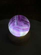 Load image into Gallery viewer, Purple Ribbon Candy Fluorite Sphere
