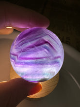 Load image into Gallery viewer, Purple Ribbon Candy Fluorite Sphere
