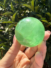 Load image into Gallery viewer, Green Fluorite Crystal Sphere – Discounted for Minor Flaw
