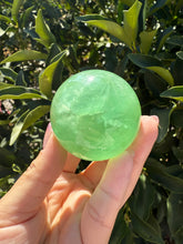 Load image into Gallery viewer, Green Fluorite Crystal Sphere – Discounted for Minor Flaw
