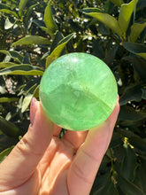 Load image into Gallery viewer, Green Fluorite Crystal Sphere – Discounted for Minor Flaw
