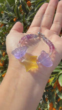 Load and play video in Gallery viewer, Handmade Fluorite Beaded Bracelet with Star and Wing Charms
